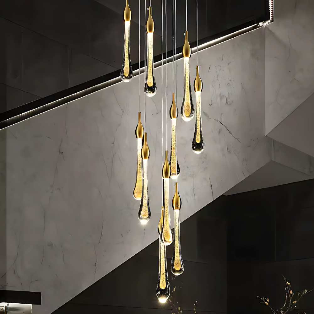 Modern chandelier with hanging glass droplet lights in a stylish interior setting.