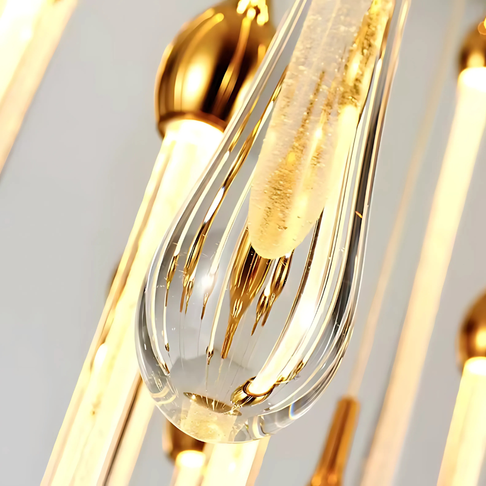 Close-up of a gold and clear glass pendant light fixture.