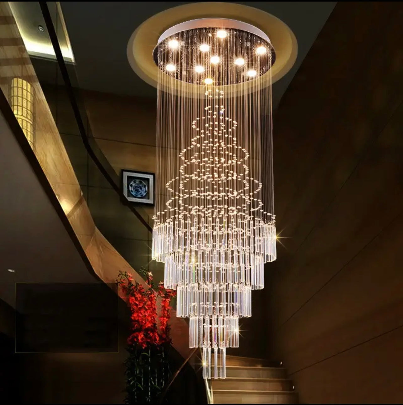 Long modern crystal chandelier designed for staircase lighting solutions