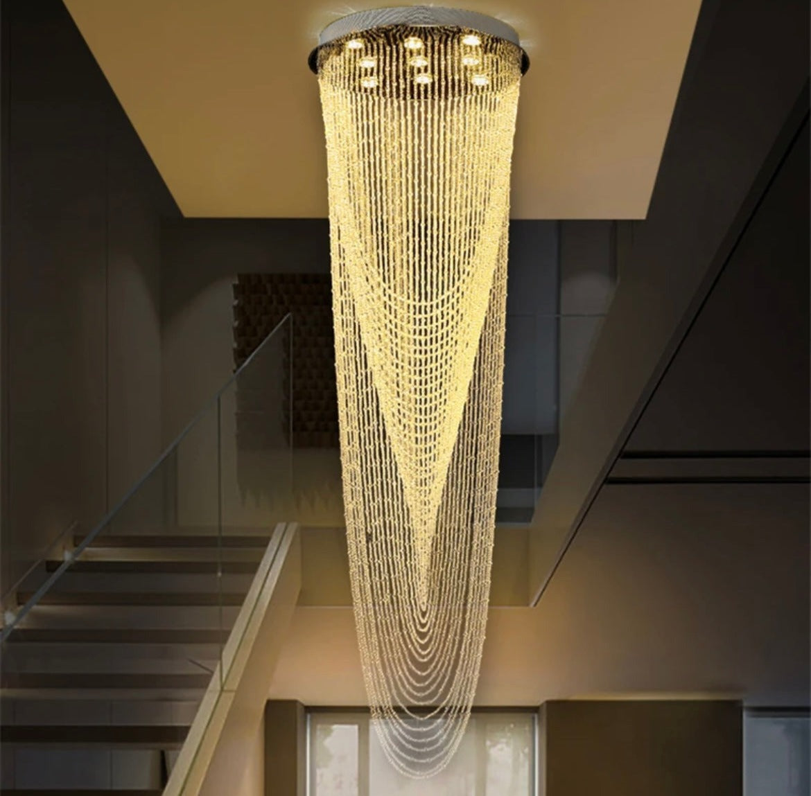 Long luxury crystal chandelier for stairwell