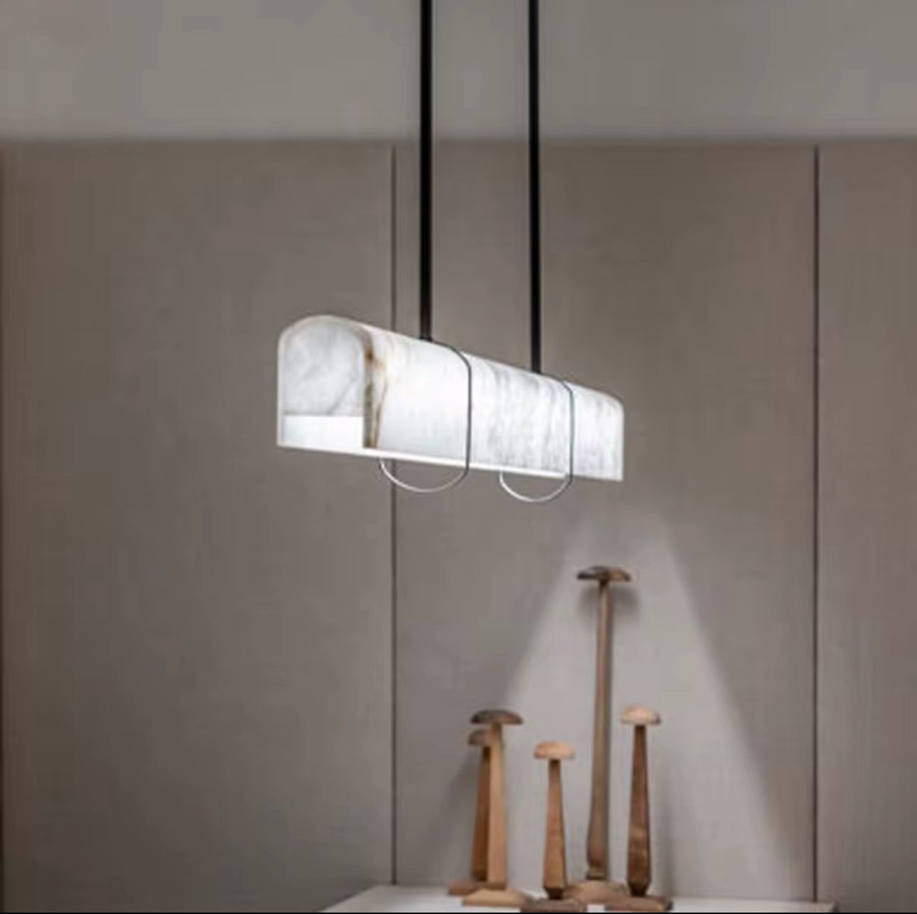 Modern pendant light fixture on a neutral background