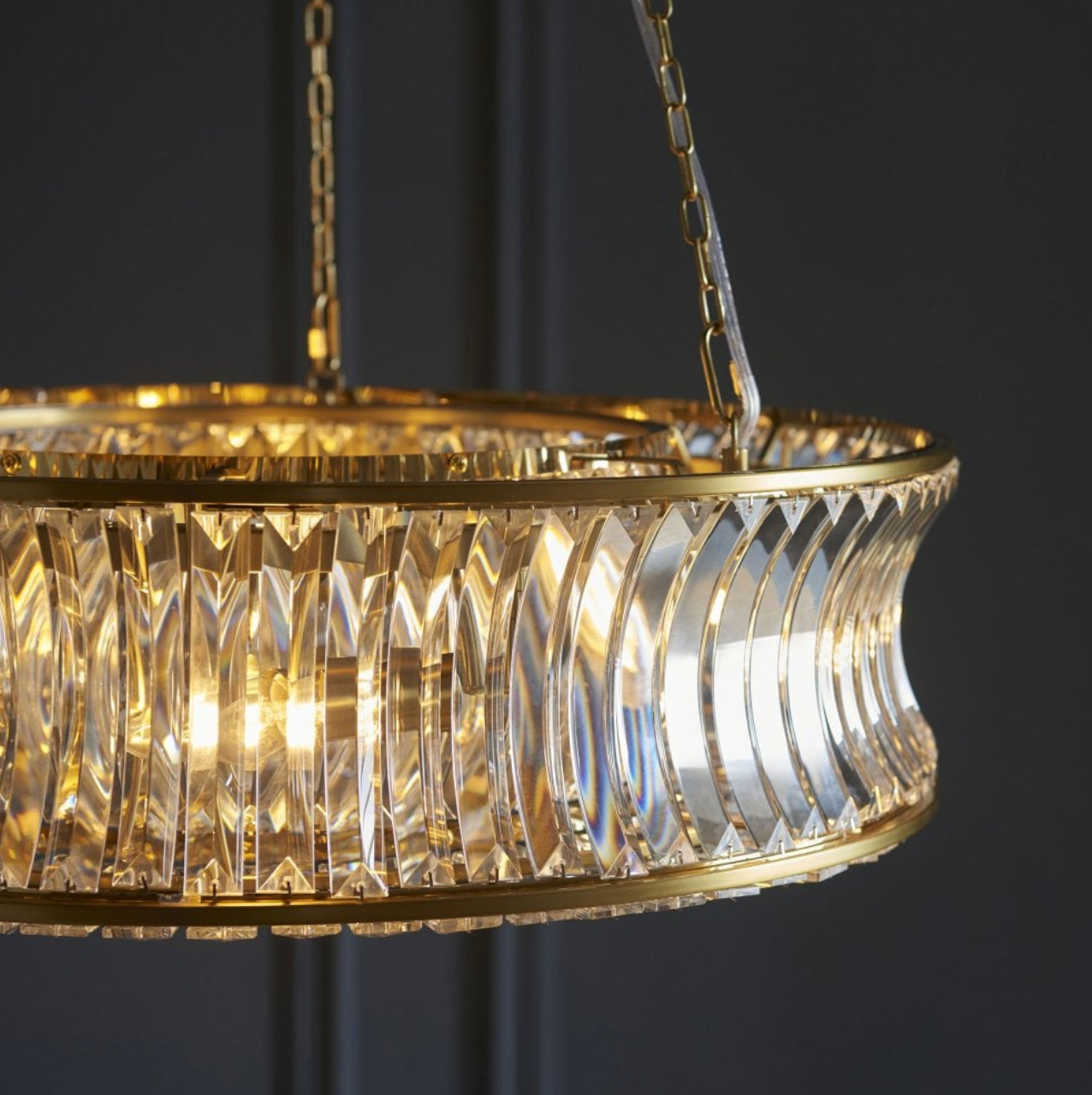 oval chandelier with gold band and crystals