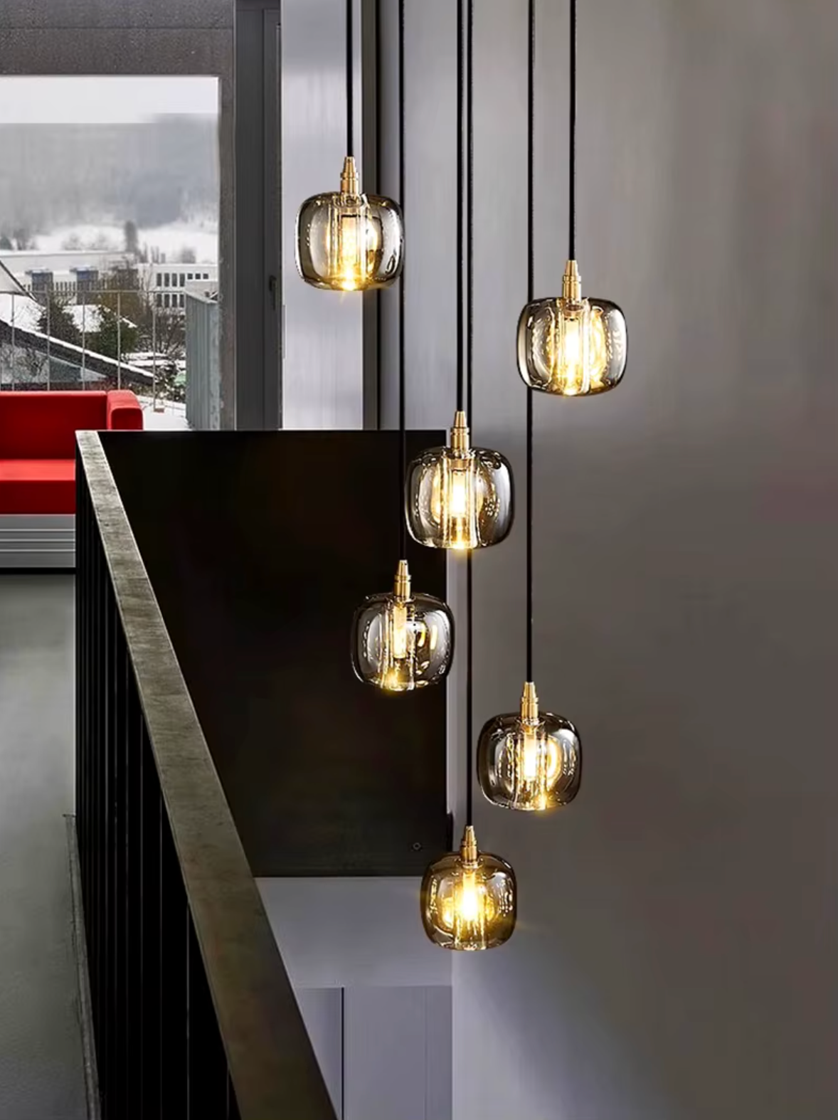 Sleek and modern bronze sphere pendant light