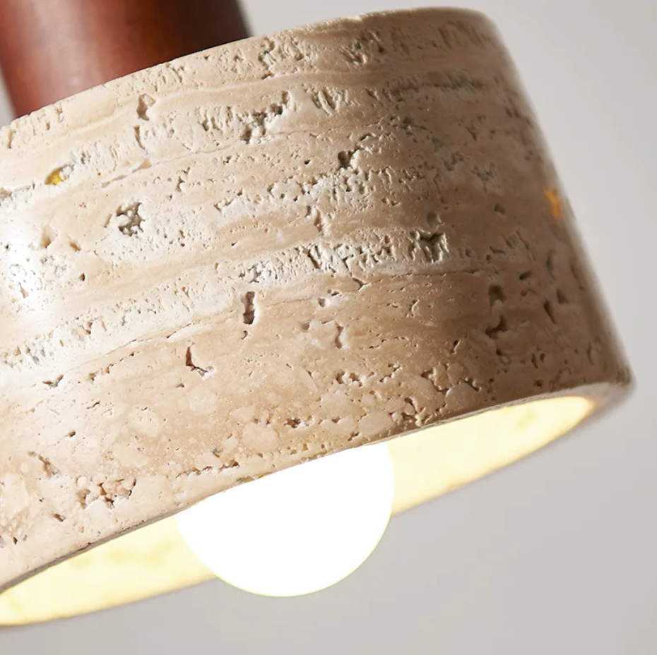 A minimalist pendant light crafted from natural stone and wood